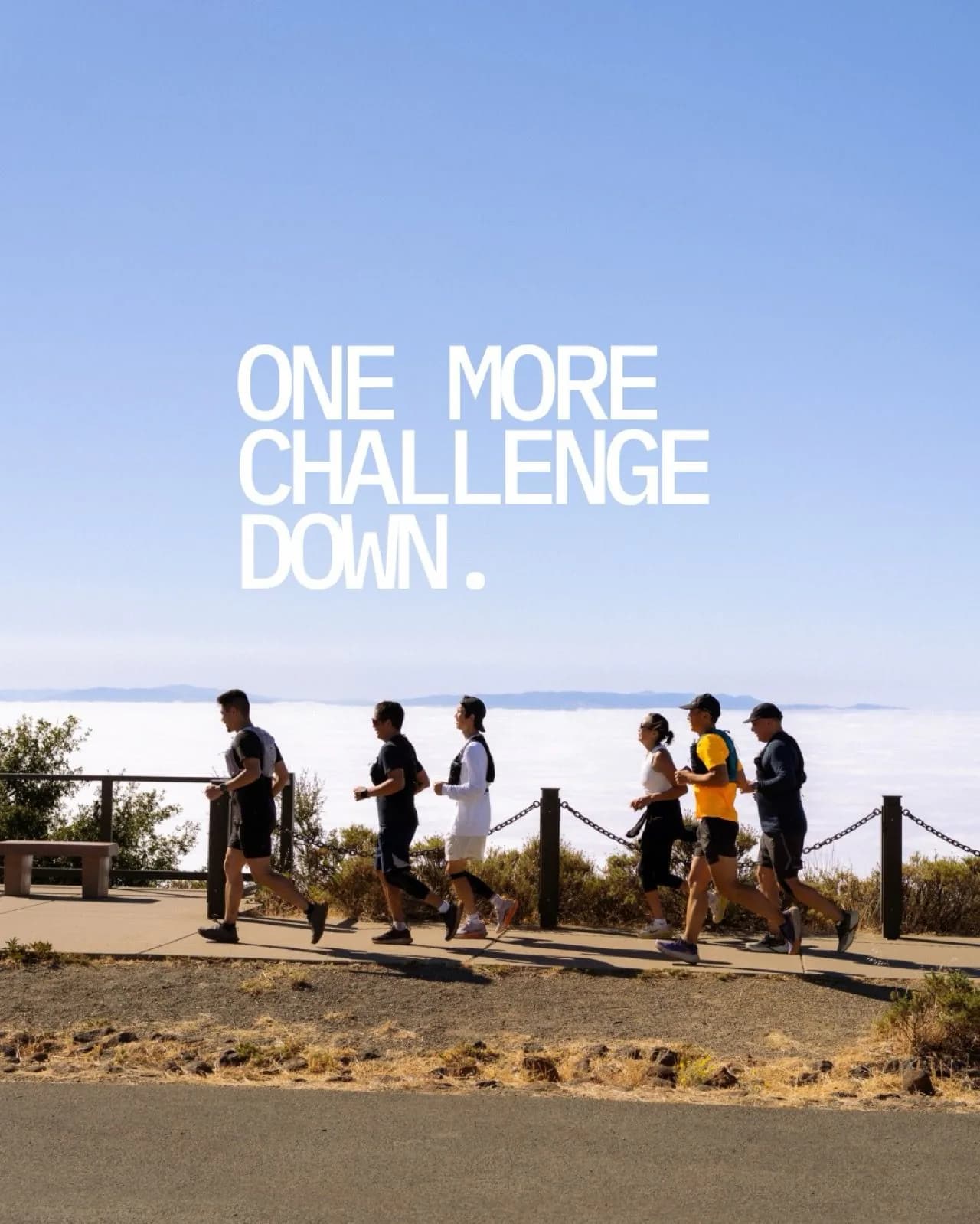 Iron Horse runners moving above the clouds with the words One More Challenge Down