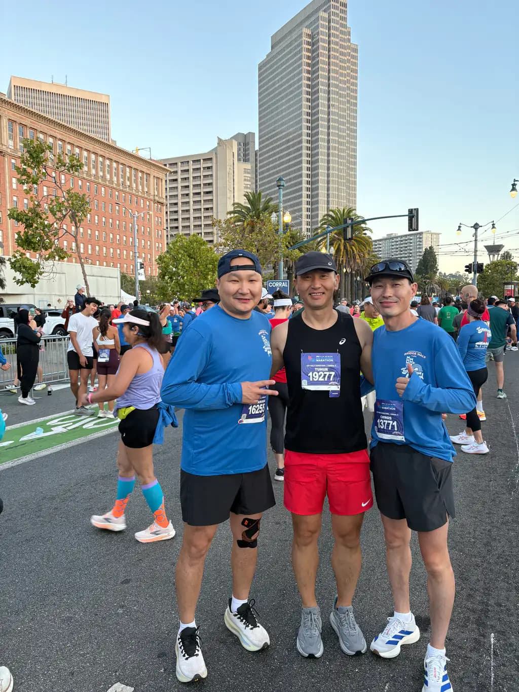 Tim with two running club friends before the 2026 San Francisco Half Marathon