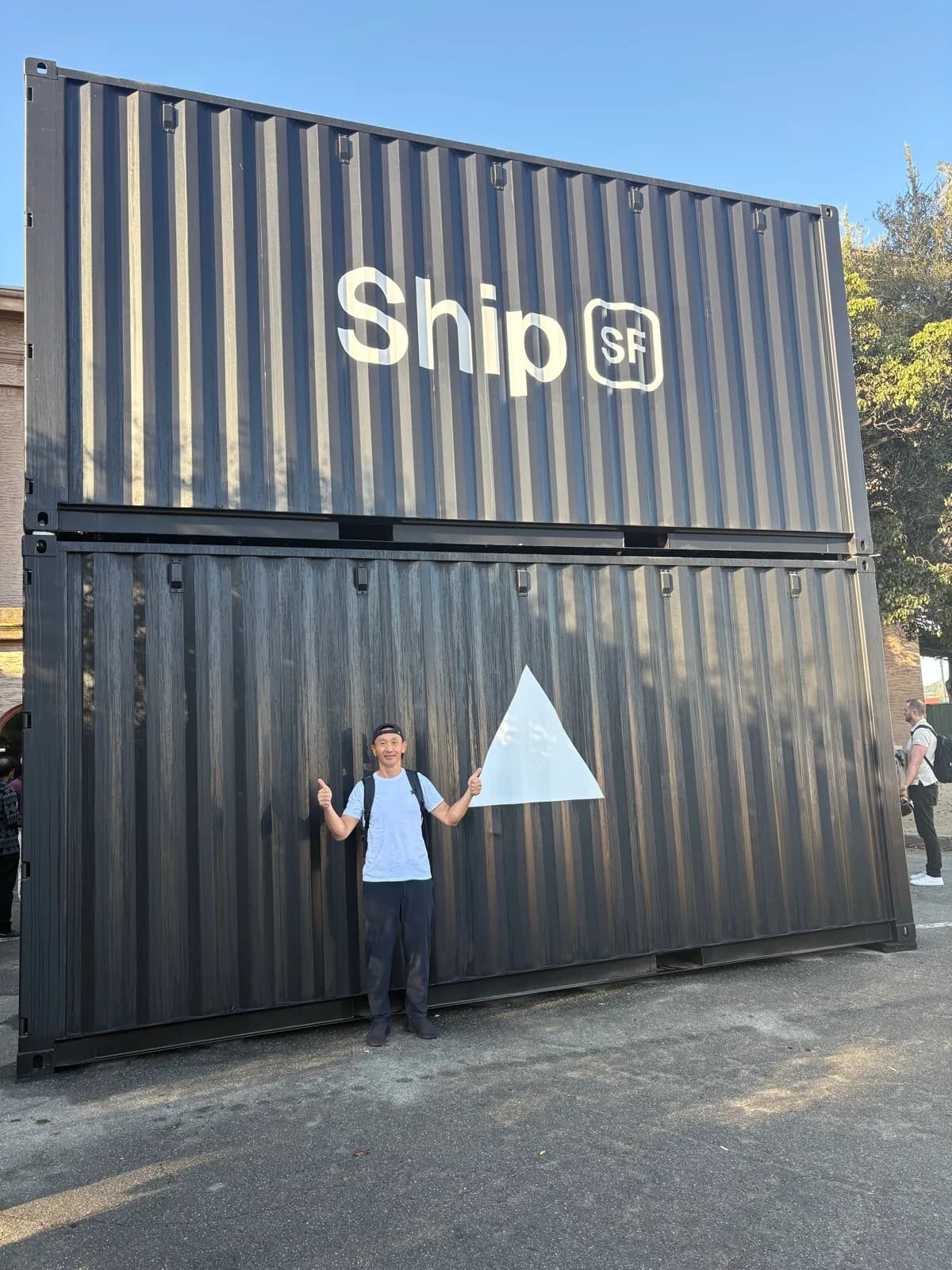 Tim standing beside the Vercel triangle at the Ship SF entrance
