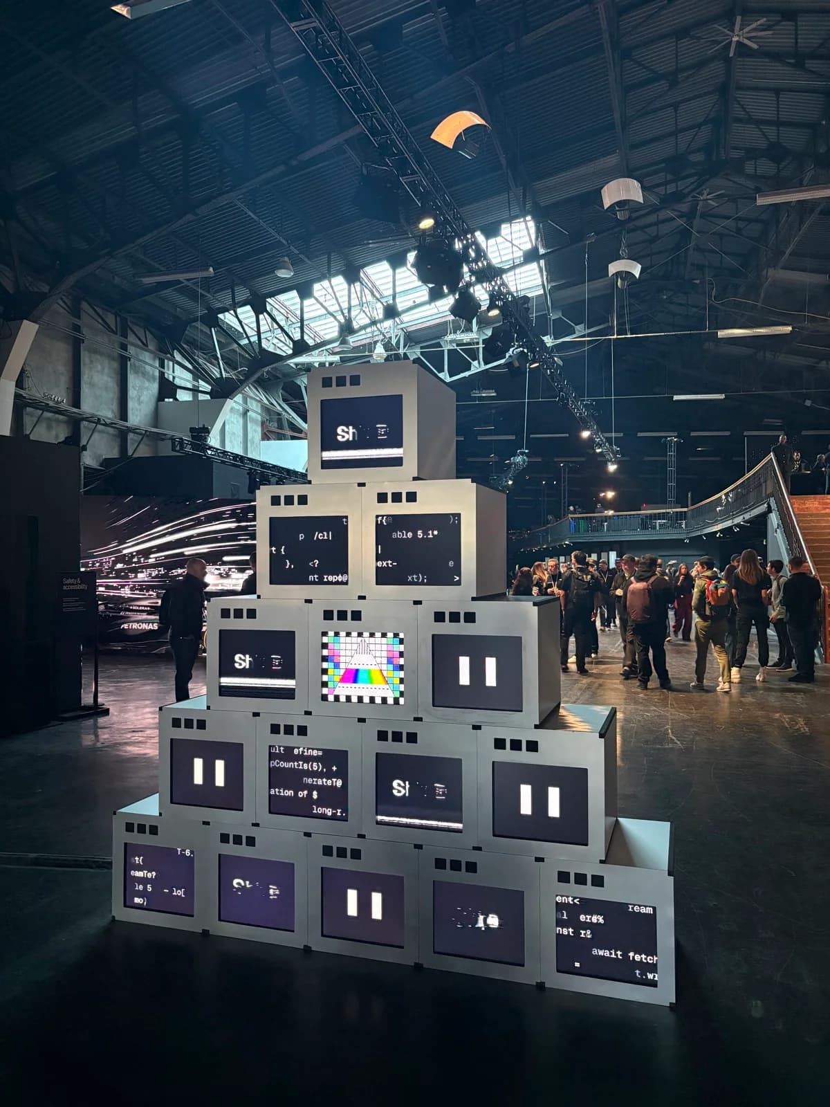 A tower of screens inside the Vercel Ship SF venue