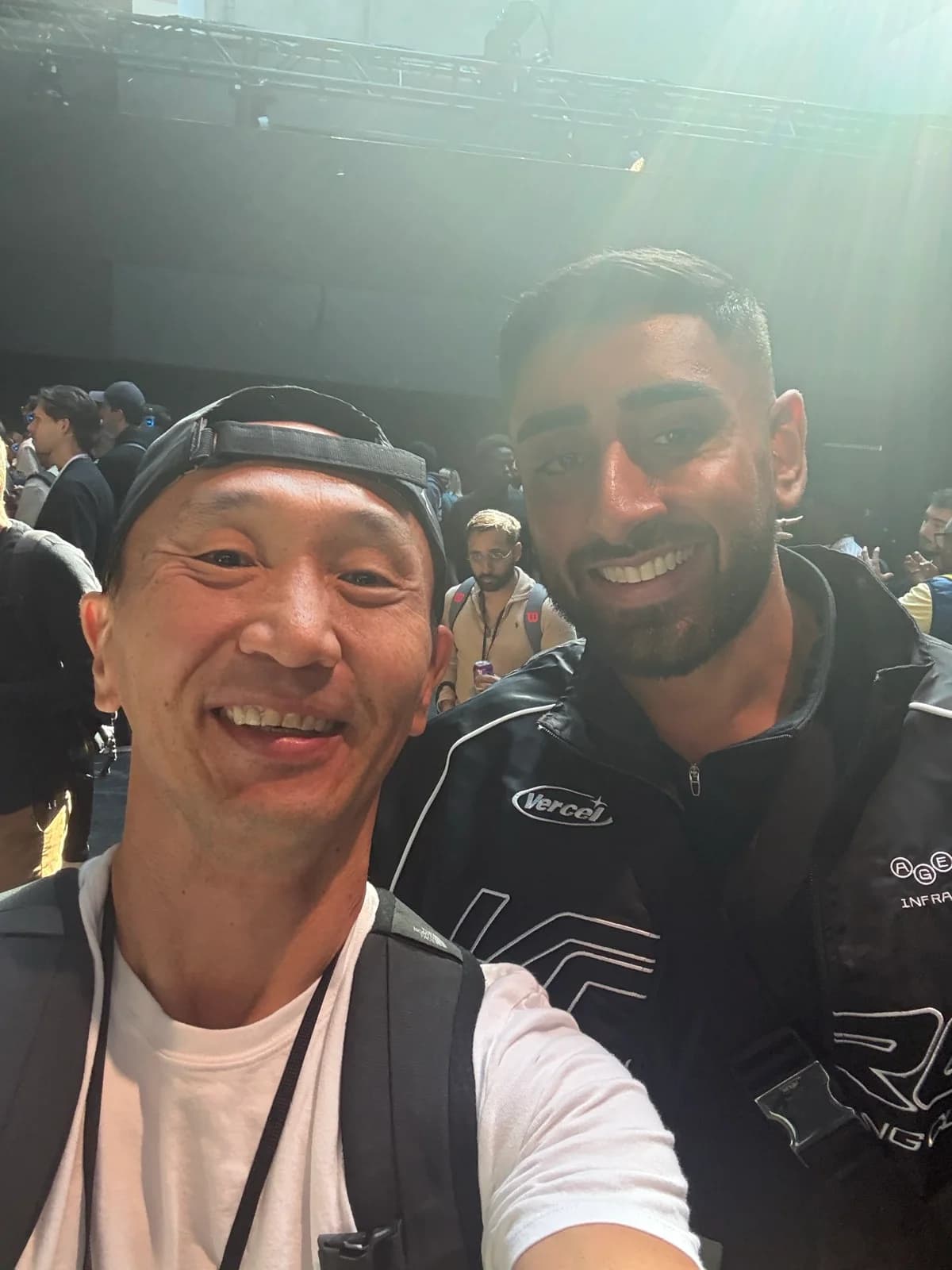 Tim smiling with another attendee inside the Ship SF venue