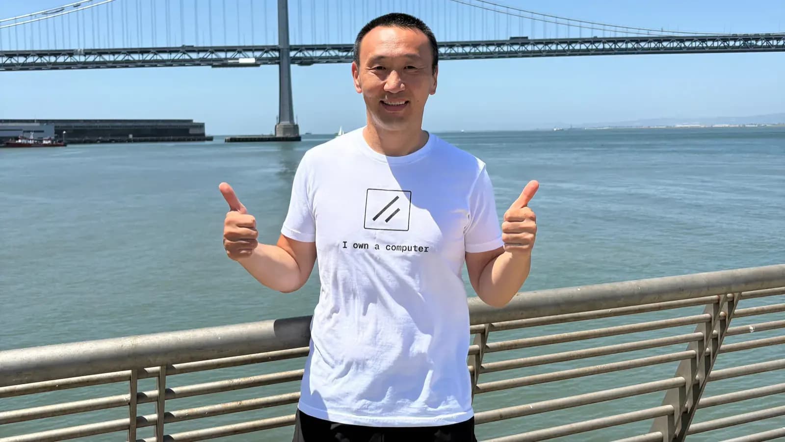 Tim wearing an I own a computer shirt near the San Francisco Bay
Bridge